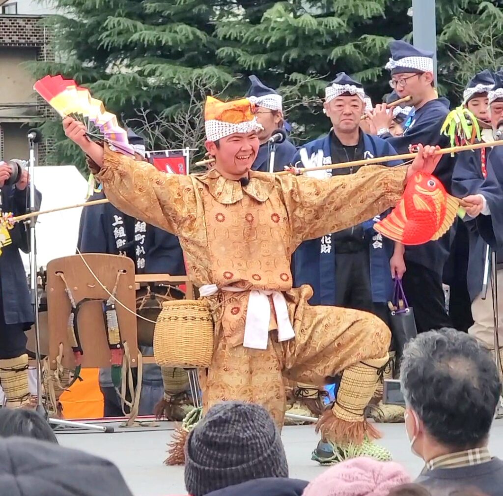恵比寿様が大きな鯛を釣り上げた「大漁」のシーン